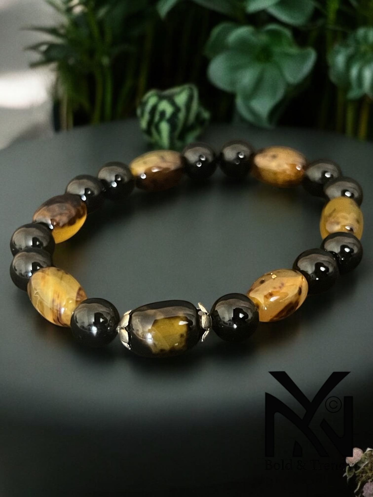 Fusion d'Essence bracelet featuring honey-colored agate and black onyx for harmony and strength