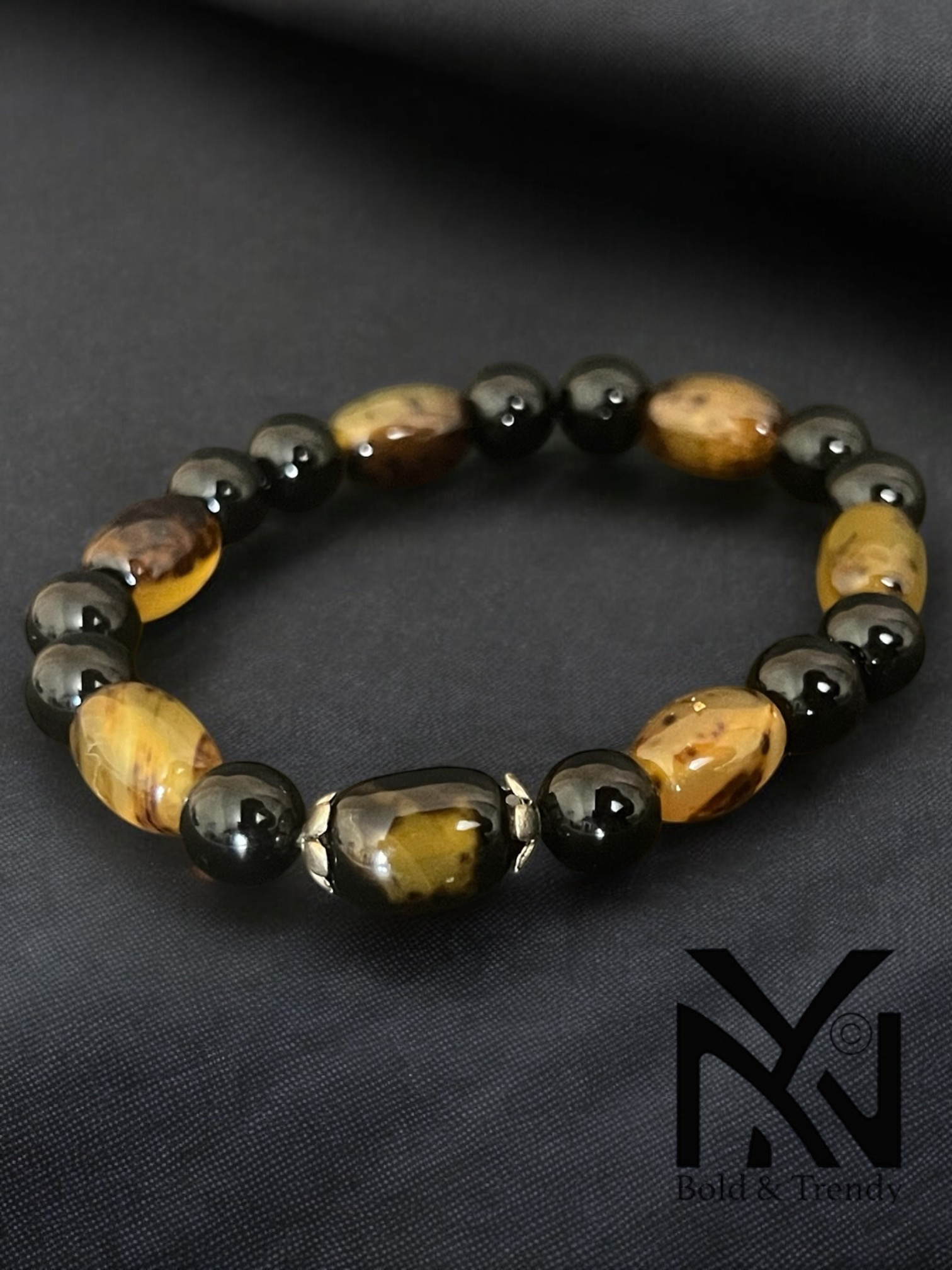 Fusion d'Essence bracelet back view showcasing a refined mix of honey agate and black onyx gemstones
